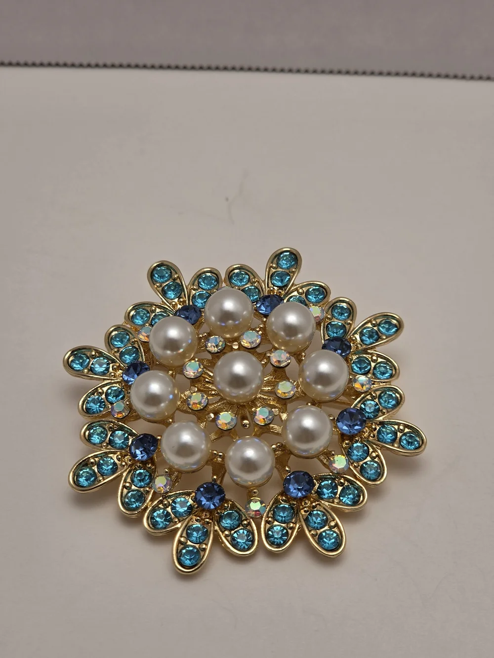 Gold Tone Floral Brooch with Blue Crystals and Pearls